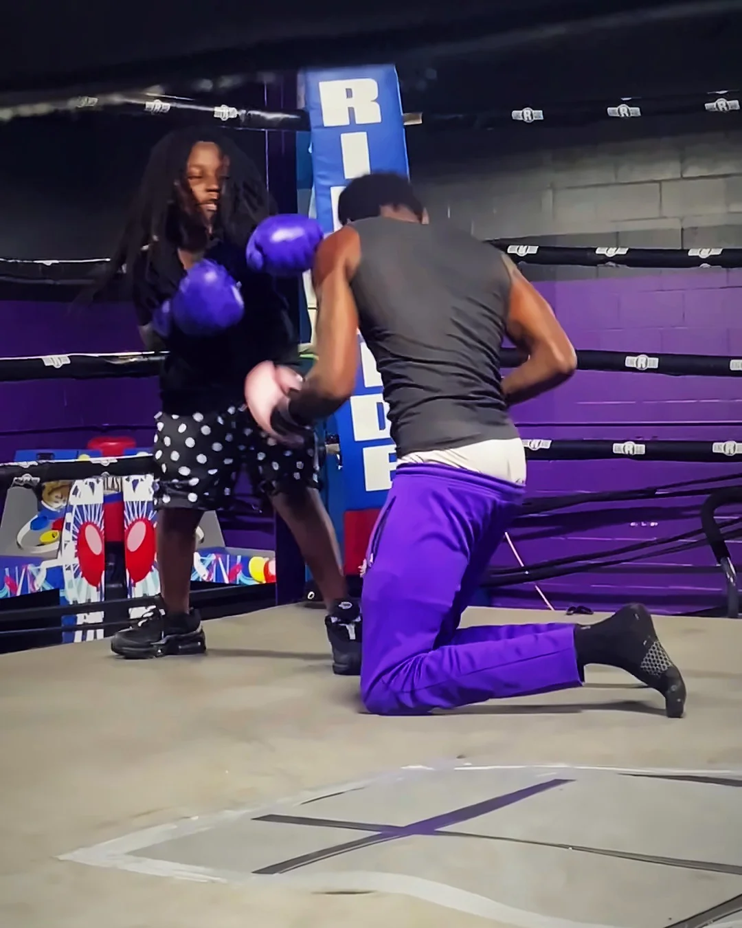 Boxing and defense drills in the purple-walled ring at Uphill Boxing